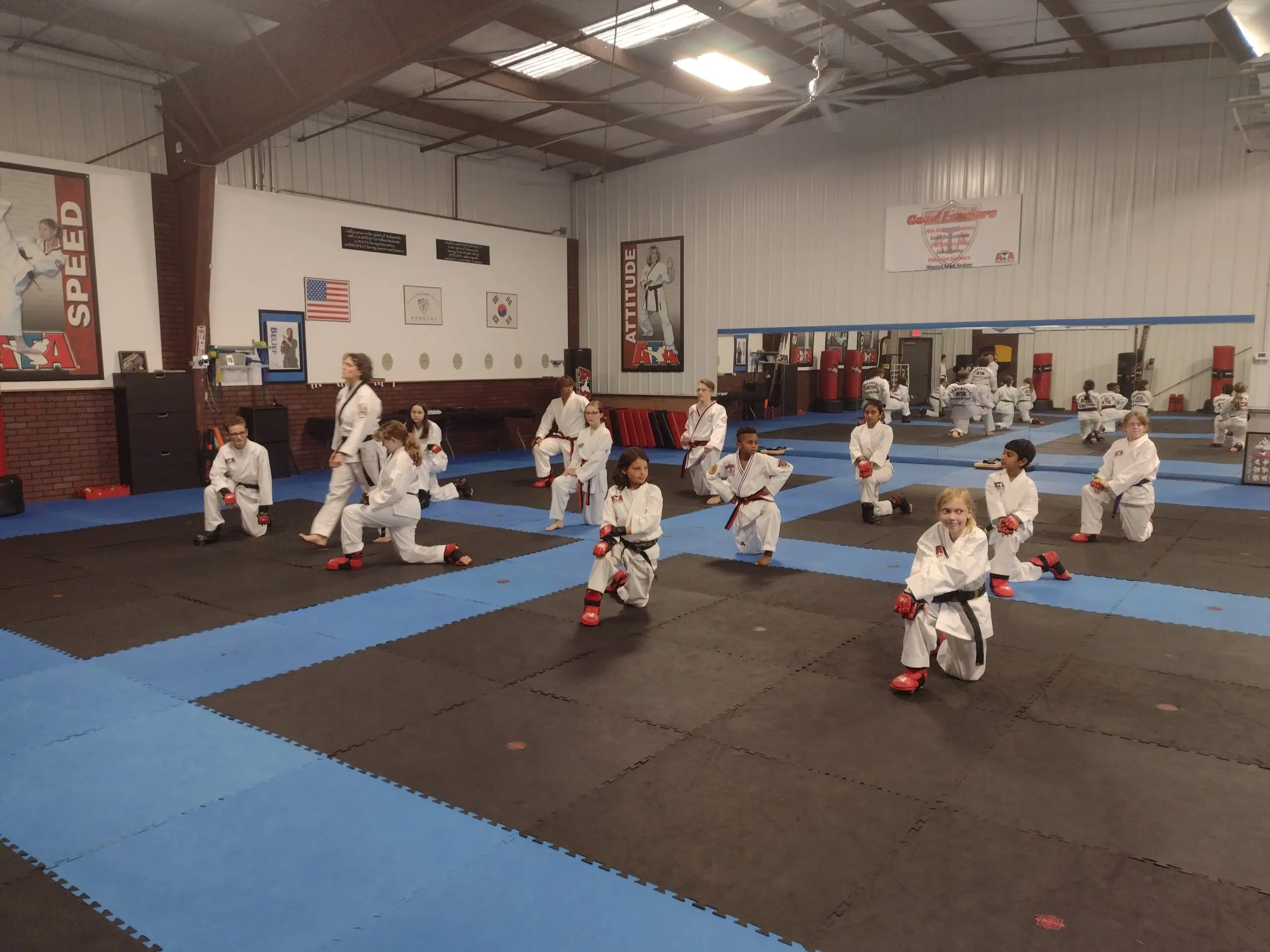 Through consistent practice of martial arts techniques like Muay Thai and Brazilian Jiu-Jitsu, students learn self-defense, build self-confidence and self-control, and experience a positive impact on their physical and mental health, as dedicated instructors teach discipline, respect, and the value of hard work in every training session.
