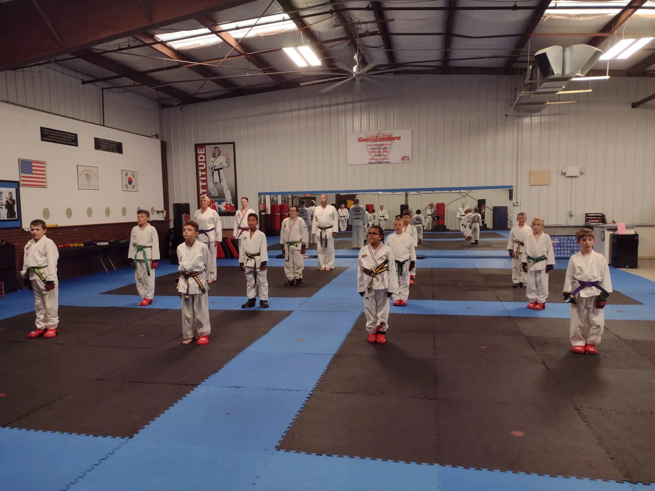 By learning various martial arts techniques such as Muay Thai, Brazilian Jiu-Jitsu, and Judo, kids develop self-defense skills, grappling techniques, self-control, physical fitness, and self-discipline, gaining self-confidence and self-respect through training guided by experienced instructors who make a positive impact on each child.