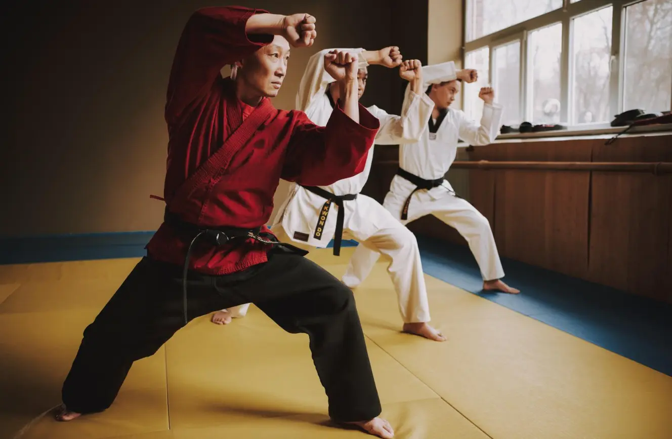 Adult martial arts self-defense classes in mixed martial arts, Krav Maga, Muay Thai, and kickboxing provide a physically demanding fighting system where martial artists work toward black belt techniques under skilled instructors, helping students build discipline, focus, combat skills, and overall physical fitness.